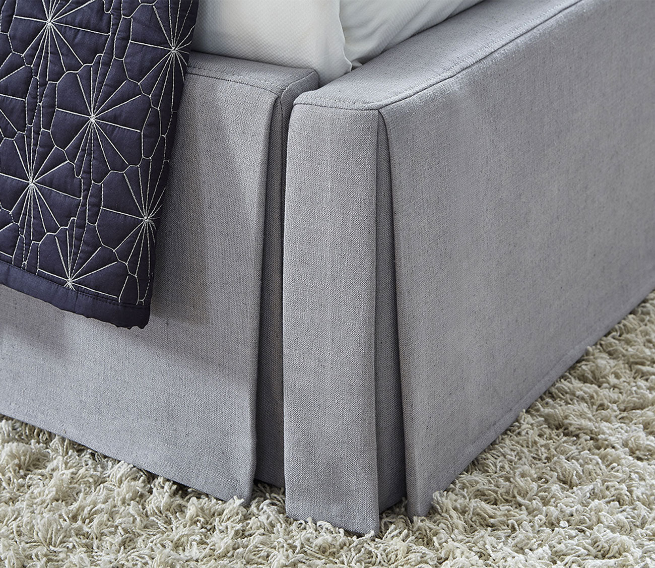 Cresta Upholstered Skirted Storage Panel Bed